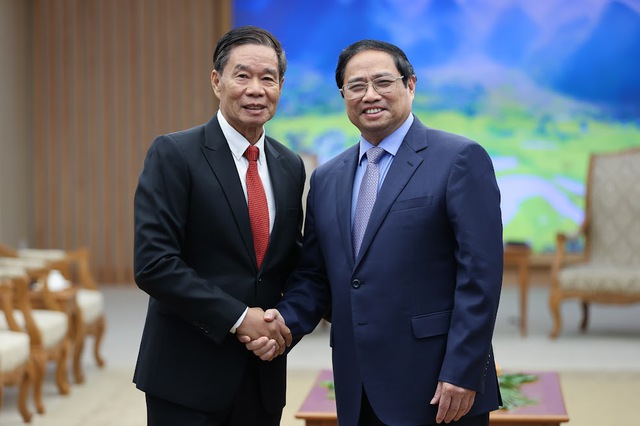 Thủ tướng Phạm Minh Chính tiếp Chủ tịch Ủy ban Trung ương Mặt trận Lào xây dựng đất nước - Ảnh 1.
