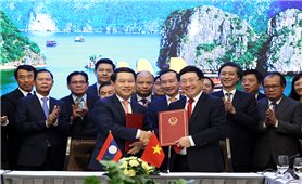 Việt Nam, Lào ký chương trình hành động hợp tác về ngoại giao kinh tế
