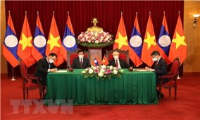 Tổng Bí thư Nguyễn Phú Trọng và Tổng Bí thư, Chủ tịch nước Lào chứng kiến Lễ ký kết văn kiện hợp tác giữa Việt Nam-Lào