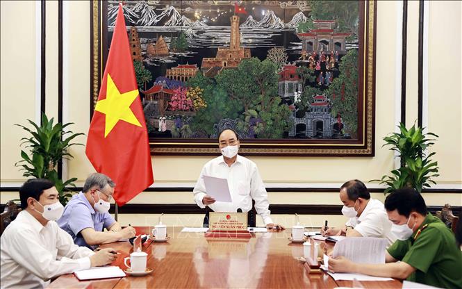 Chủ tịch nước Nguyễn Xuân Phúc chủ trì cuộc họp. Ảnh: Thống Nhất/TTXVN