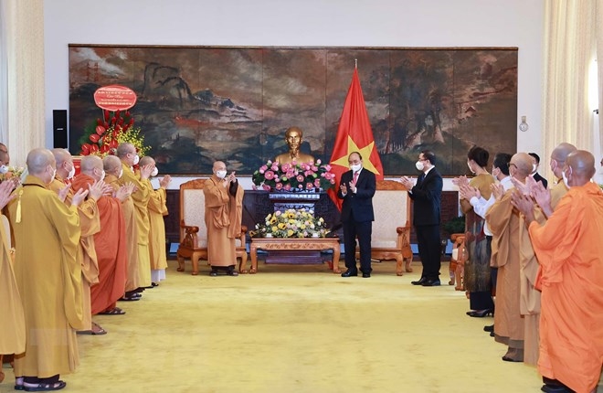 Chủ tịch nước Nguyễn Xuân Phúc với các đại biểu tại buổi tiếp. Ảnh: Thống Nhất/TTXVN