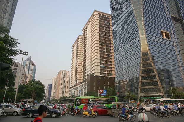 Giá đất nền hạ nhiệt tại nhiều nơi, nhưng giá chung cư tại Hà Nội và TP Hồ Chí Minh vẫn tiếp tục gia tăng. (Ảnh minh họa: TTXVN)