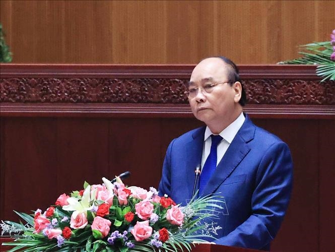 Chủ tịch nước Nguyễn Xuân Phúc phát biểu tại Kỳ họp lần thứ nhất, Quốc hội Lào khóa IX. Ảnh: Thống Nhất/TTXVN