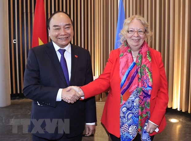 Chủ tịch nước Nguyễn Xuân Phúc gặp Tổng Giám đốc Văn phòng Liên Hợp Quốc tại Geneve, bà Tatiana Valovaya. (Ảnh: Thống Nhất/TTXVN)