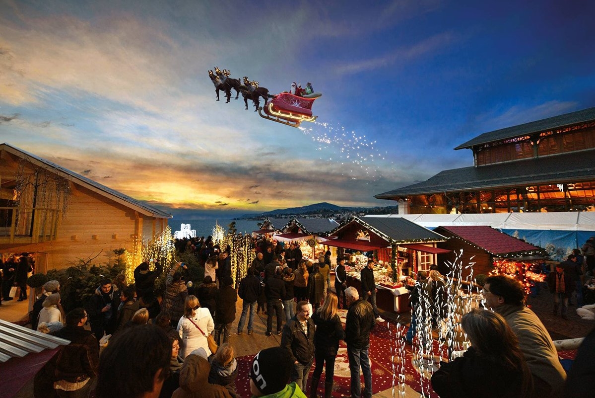 Hình ảnh ông già Noel bay trên trời thu hút khách đến hội chợ Giáng sinh bên hồ Geneva. Ảnh: Montreux Noel