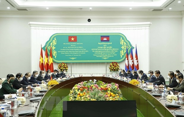 Chủ tịch nước Nguyễn Xuân Phúc gặp Thủ tướng Campuchia Samdech Techo Hun Sen. (Ảnh: Thống Nhất/TTXVN)