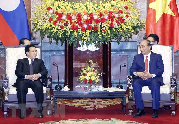 Chủ tịch nước Nguyễn Xuân Phúc tiếp Thủ tướng Chính phủ nước CHDCND Lào Phankham Viphavanh. Ảnh: TTXVN