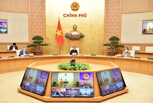 Phó Thủ tướng Chính phủ Lê Văn Thành chủ trì họp trực tuyến với các bộ, địa phương liên quan về tình hình xử lý hàng hóa ùn tắc tại các cửa khẩu biên giới phía Bắc. (Ảnh: VGP/Đức Tuân)