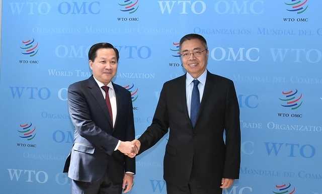 Phó Thủ tướng Chính phủ Lê Minh Khái và Phó Tổng Giám đốc WTO Trương Hướng Thần - Ảnh: VGP/Trần Mạnh