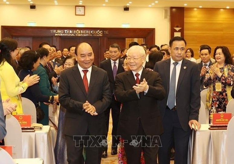 Tổng Bí thư Nguyễn Phú Trọng và Chủ tịch nước Nguyễn Xuân Phúc đến dự Lễ kỷ niệm. (Ảnh: TTXVN)