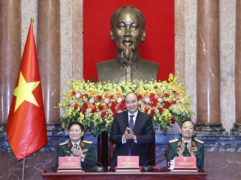 Chủ tịch nước Nguyễn Xuân Phúc chủ trì buổi gặp mặt. (Ảnh: TTXVN)