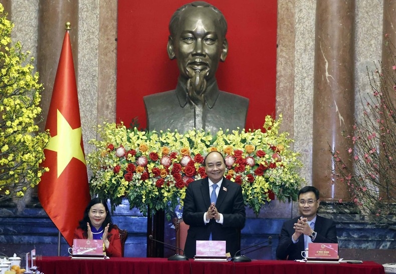 Chủ tịch nước Nguyễn Xuân Phúc tại buổi gặp mặt các nhân vật trong Chương trình "Việc tử tế" năm 2022. (Ảnh: TTXVN)