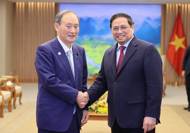 Thủ tướng Phạm Minh Chính tiếp nguyên Thủ tướng Nhật Bản Suga Yoshihide - Ảnh: VGP/Nhật Bắc
