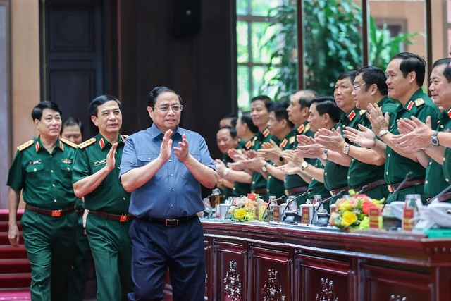 Thủ tướng Phạm Minh Chính tới dự Hội nghị Quân chính toàn quân - Ảnh: VGP/Nhật Bắc