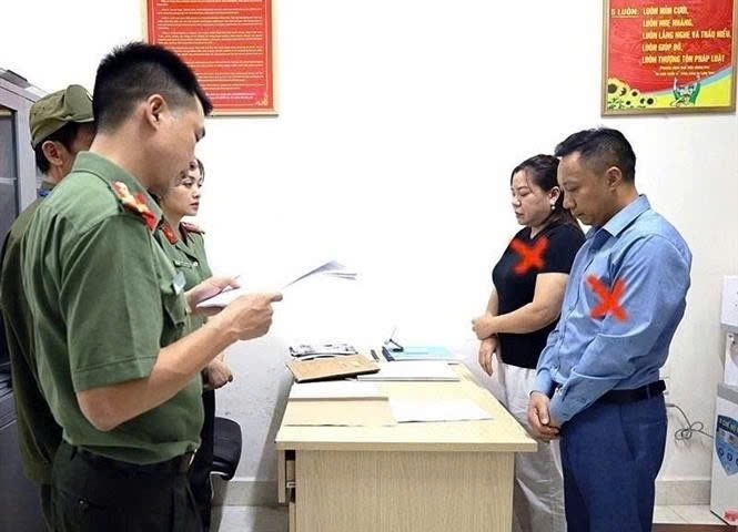 Đối tượng Nguyễn Đông Bắc và Tống Thị Hồng Thắm là 2 trong số 12 đối tượng bị Công an tỉnh Lạng Sơn bắt tạm giam. Ảnh: TTXVN 